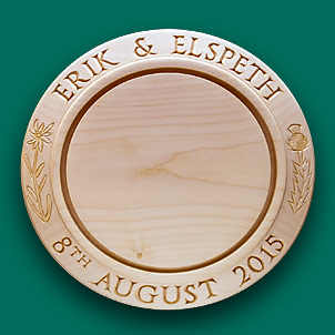 A bread board decorated with Edlweiss and a Thistle.